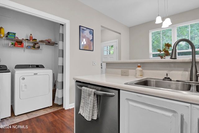 interior space with separate washer and dryer, sink, and dark wood-type flooring