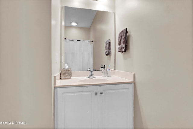 bathroom with vanity and a shower with shower curtain