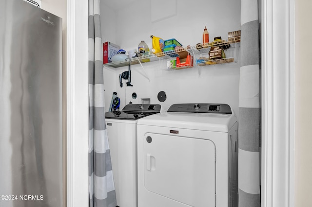 clothes washing area featuring washing machine and dryer