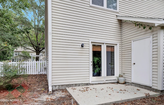 doorway to property with a patio area