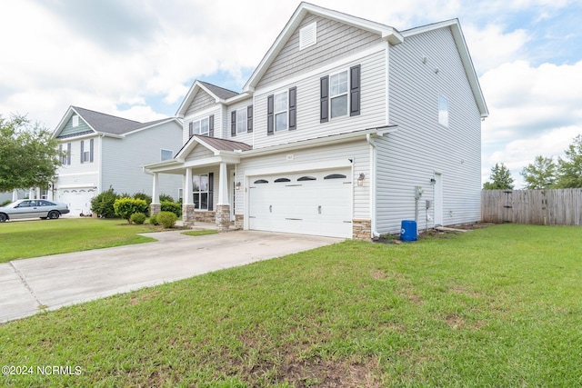 view of front of property featuring a garage and a front lawn