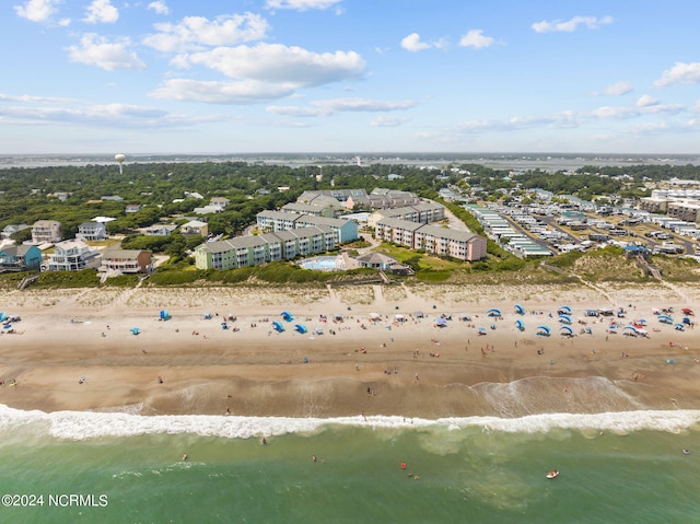 aerial view with a water view and a view of the beach