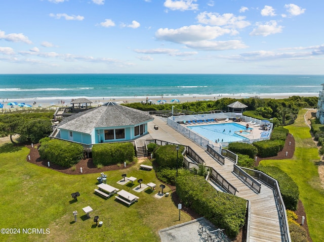 aerial view with a water view and a view of the beach