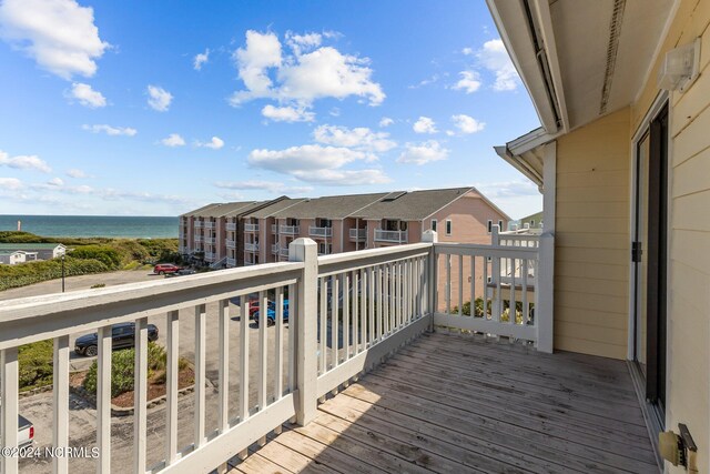 wooden deck featuring a water view