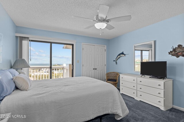 carpeted bedroom with a closet, ceiling fan, a textured ceiling, and access to exterior