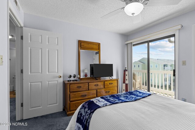 carpeted bedroom featuring ceiling fan, a textured ceiling, and access to exterior