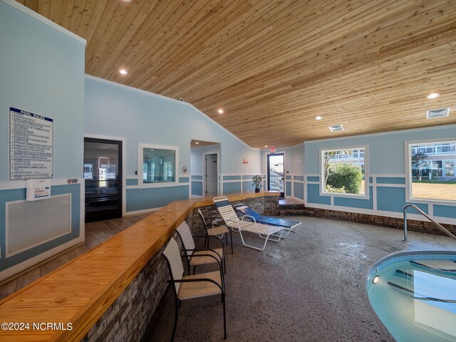 interior space featuring wood ceiling, hardwood / wood-style flooring, and lofted ceiling