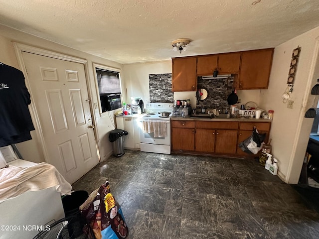 kitchen with a textured ceiling and white electric stove