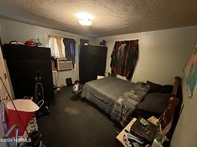 bedroom with cooling unit, a textured ceiling, and carpet flooring