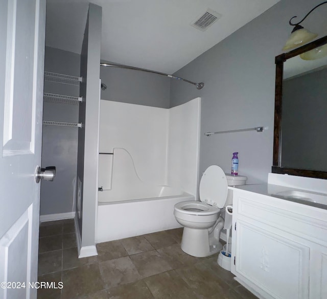 full bathroom with tile patterned flooring, shower / washtub combination, vanity, and toilet