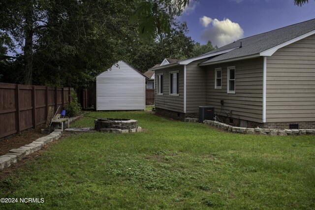 view of yard with central AC