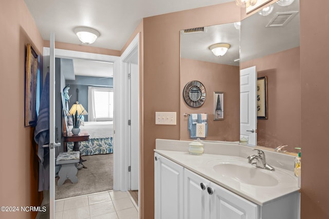 bathroom featuring vanity, visible vents, and tile patterned flooring