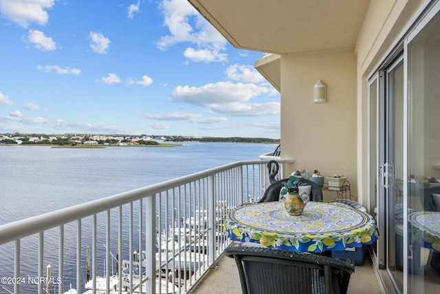 balcony featuring a water view