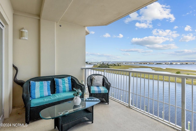 balcony featuring a water view