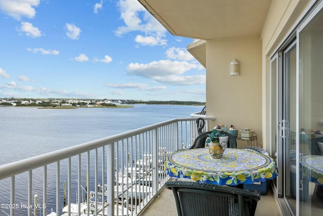 balcony featuring a water view