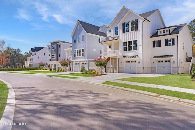 multi unit property featuring a garage and a front lawn