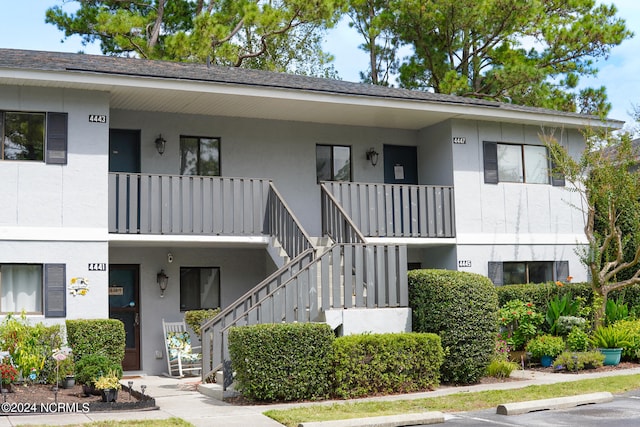 townhome / multi-family property with a balcony