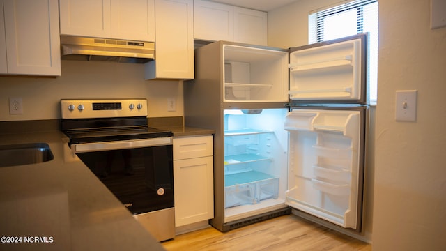 kitchen featuring range hood, light hardwood / wood-style flooring, refrigerator, stainless steel electric stove, and white cabinetry