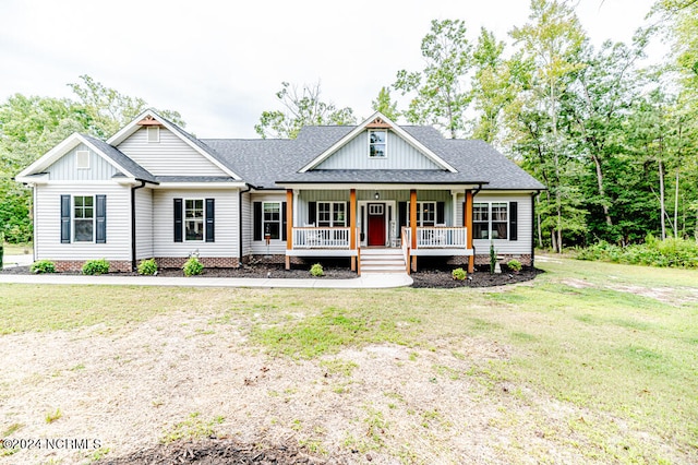 view of front of house with a front lawn and covered porch