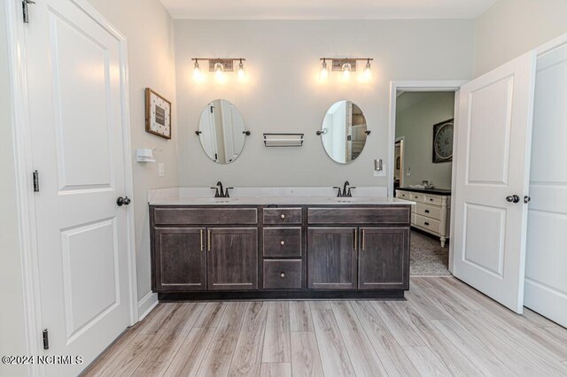 bathroom featuring vanity and hardwood / wood-style flooring