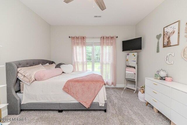 bedroom featuring ceiling fan and light colored carpet