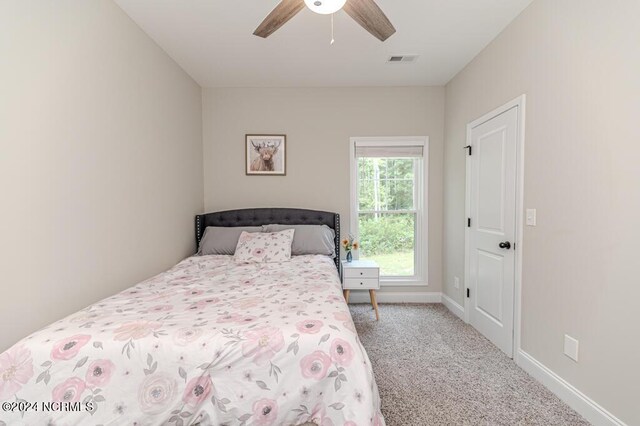 carpeted bedroom with ceiling fan