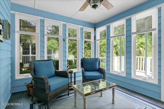 sunroom / solarium with ceiling fan