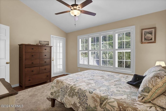 bedroom with lofted ceiling, ceiling fan, multiple windows, and baseboards