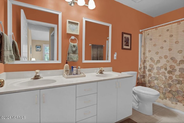 full bathroom with tile patterned floors, a sink, toilet, and double vanity