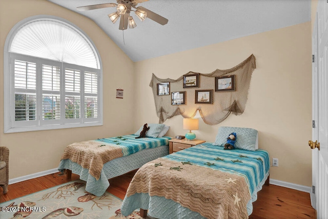 bedroom featuring lofted ceiling, hardwood / wood-style floors, and ceiling fan