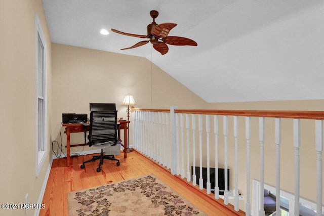 office space with lofted ceiling, ceiling fan, and light hardwood / wood-style flooring