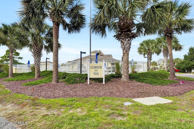 community sign featuring fence