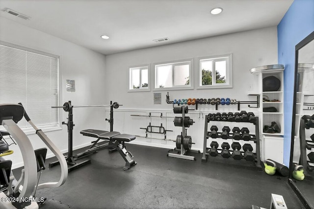 exercise area with visible vents and recessed lighting