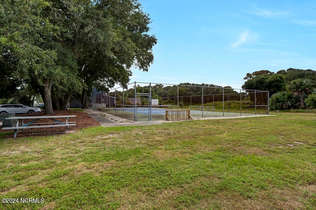 view of yard with tennis court