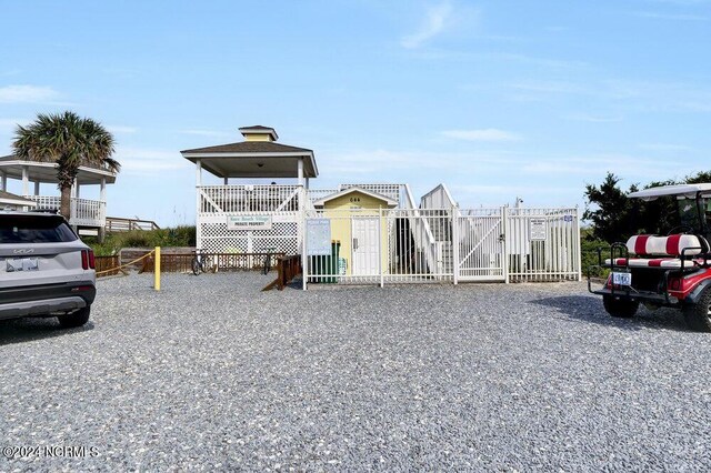 exterior space featuring fence and a playground