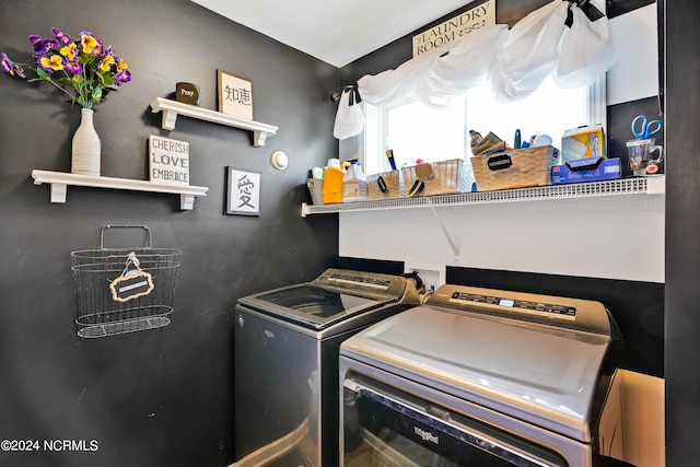 laundry room with washing machine and clothes dryer