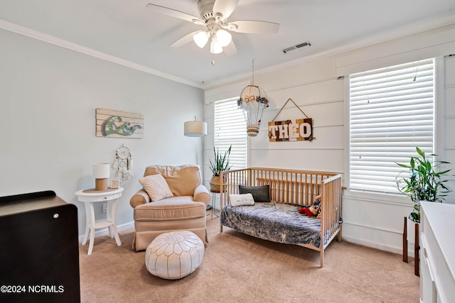 living area with ceiling fan, carpet floors, and a healthy amount of sunlight