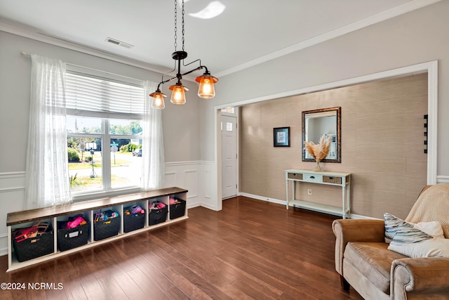 interior space featuring dark hardwood / wood-style floors and ornamental molding