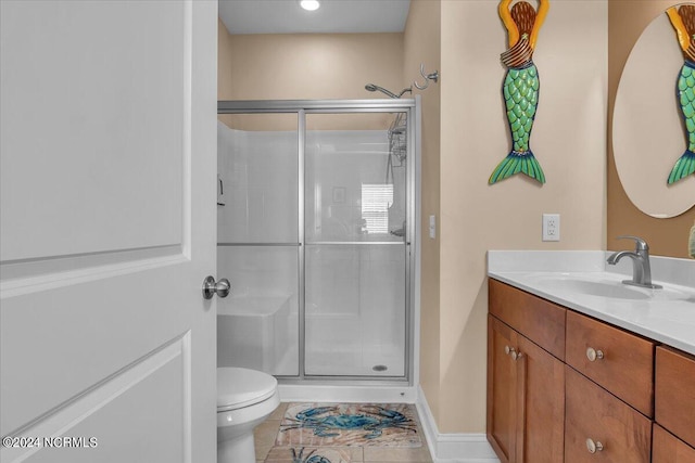 full bathroom with tile patterned floors, toilet, a stall shower, and vanity