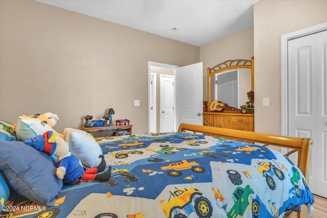 bedroom with wood finished floors