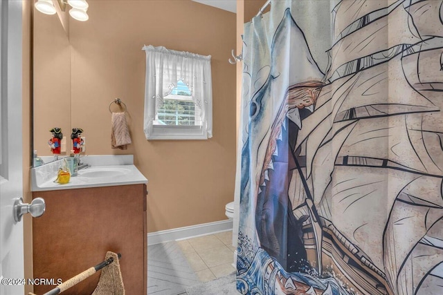 bathroom featuring vanity, baseboards, tile patterned flooring, curtained shower, and toilet