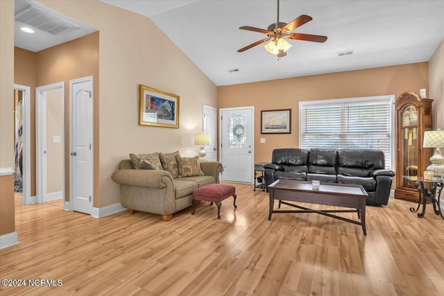 living room with visible vents, baseboards, ceiling fan, and light wood finished floors