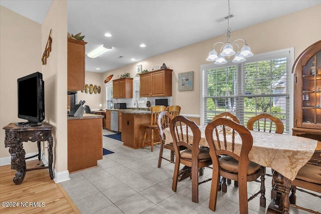 dining area with light tile patterned floors, visible vents, baseboards, an inviting chandelier, and recessed lighting