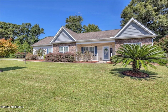 ranch-style house with brick siding and a front yard