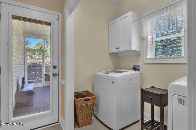 laundry area featuring washer / clothes dryer and cabinet space