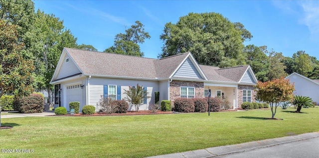 view of front of property featuring a front yard, an attached garage, and stone siding