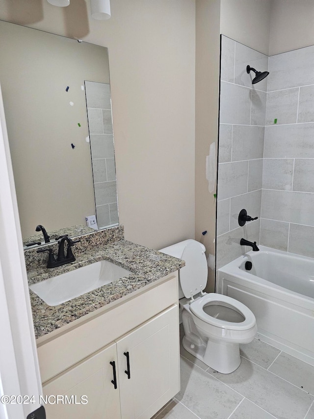 full bathroom featuring vanity, toilet, and tiled shower / bath