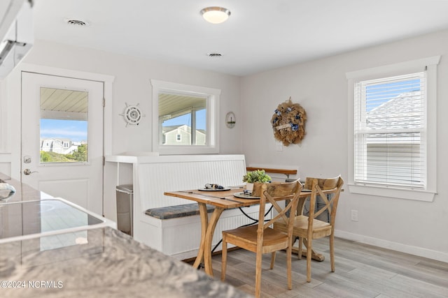 dining area featuring light hardwood / wood-style floors and breakfast area