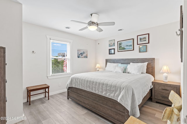 bedroom featuring ceiling fan and light hardwood / wood-style flooring