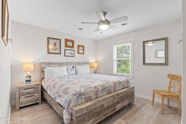 bedroom with ceiling fan and light hardwood / wood-style floors